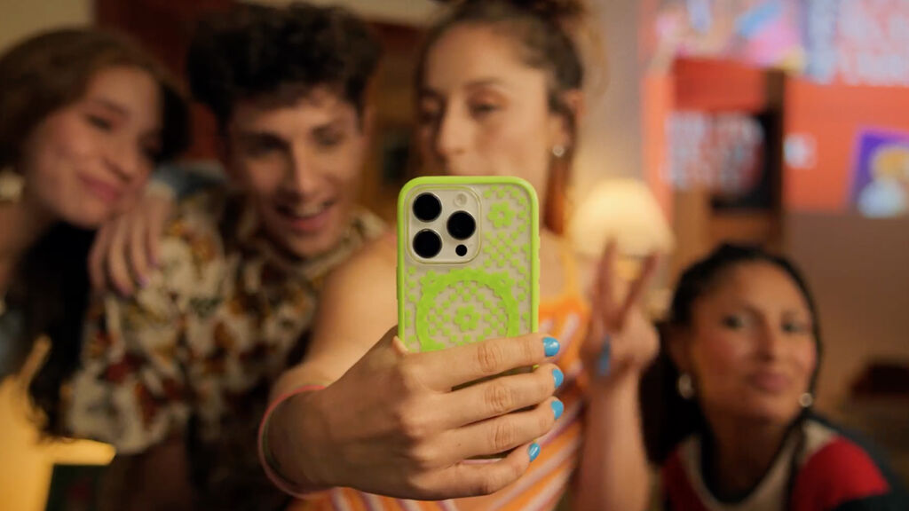 woman holding a bright green iphone case | OtterBox